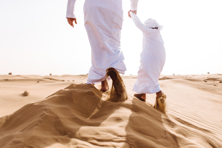 Father and son spending time in the desertの写真素材