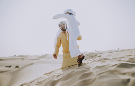 Father and son spending time in the desertの写真素材