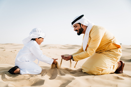Father and son spending time in the desertの写真素材