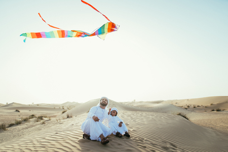 Father and son spending time in the desertの写真素材
