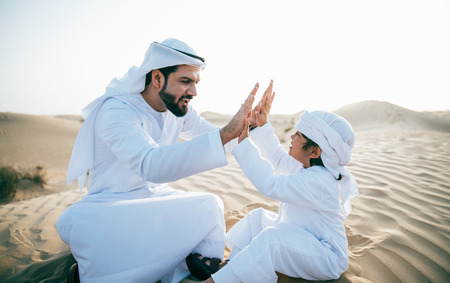 Father and son spending time in the desert