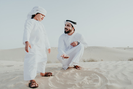 Father and son spending time in the desertの写真素材