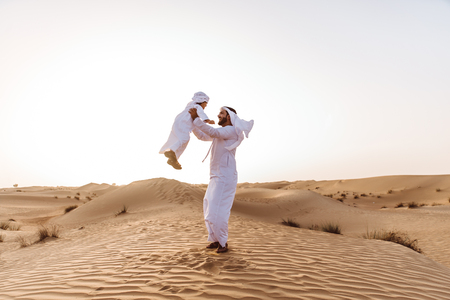 Father and son spending time in the desertの写真素材