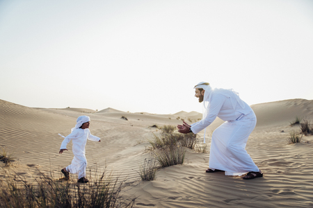 Father and son spending time in the desertの写真素材