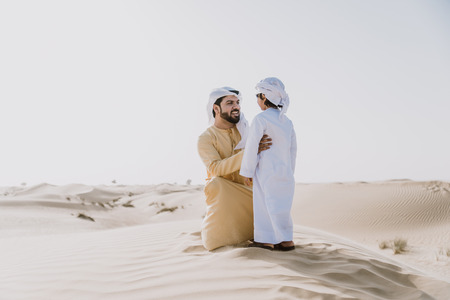 Father and son spending time in the desertの写真素材