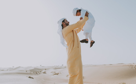 Father and son spending time in the desertの写真素材