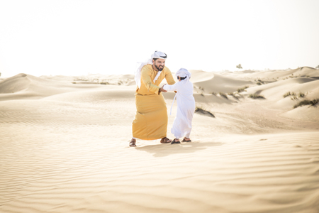 Father and son spending time in the desertの写真素材