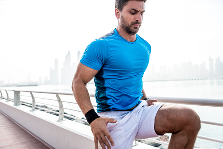 Beautiful man doing work out and different exercises outdoor