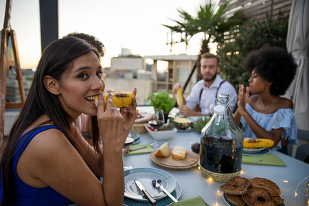 Multi-ethnic group of friends having party on  rooftop - Happy people bonding and having funの写真素材