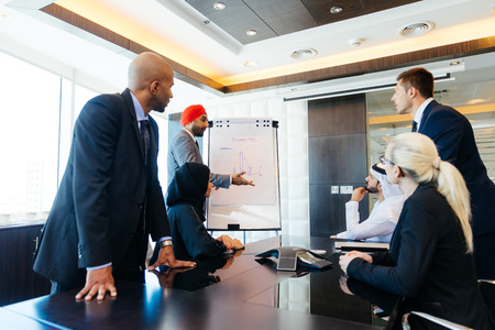 Multicultural business people meeting and talking about business - Multiracial business team meeting