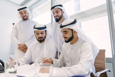 Arabian men meeting and talking about business - Businessmen portrait in Dubai