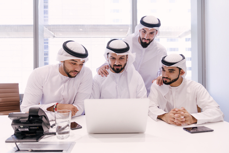 Arabian men meeting and talking about business - Businessmen portrait in Dubaiの写真素材