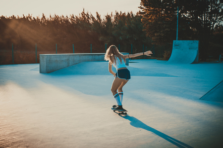 Beautiful skater girl lifestyle moments in a skateparkの写真素材