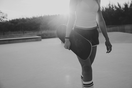 Beautiful skater girl lifestyle moments in a skateparkの写真素材