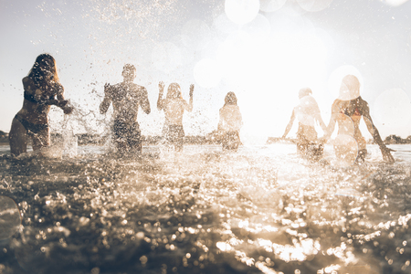 Friends having fun at the seaの写真素材