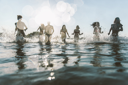 Friends having fun at the seaの写真素材