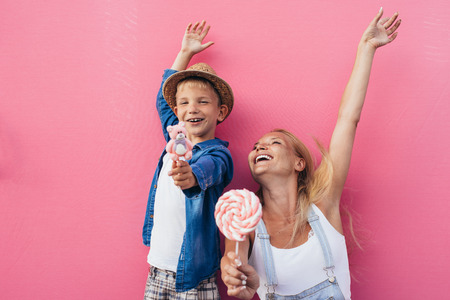 Beautiful mother and son on colored backgroundsの写真素材