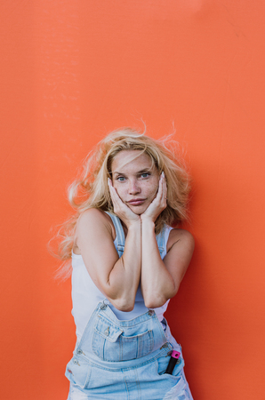 Beautiful girl lifestyle moments on colored backgroundsの写真素材