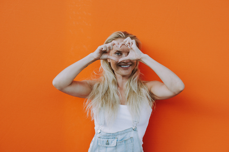 Beautiful girl lifestyle moments on colored backgroundsの写真素材