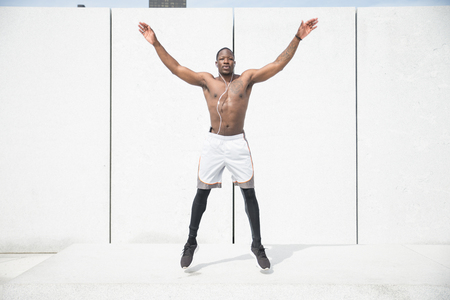 Sportive man training outdoorsの写真素材