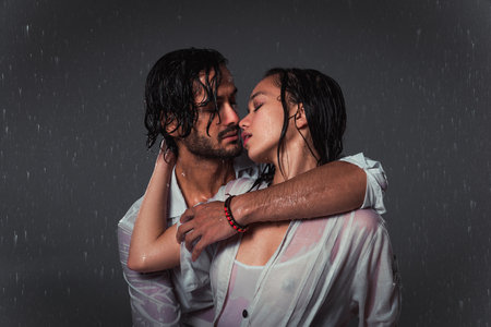 Couple of lovers under the rainの写真素材