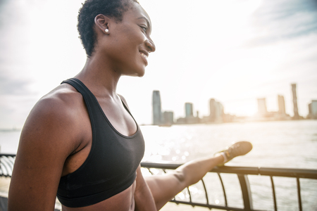 Pretty woman running in New York - Sportive woman training outdoorsの写真素材