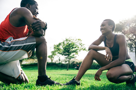 Couple running in New York - Sportive man and woman training outdoors and resting after a runの写真素材
