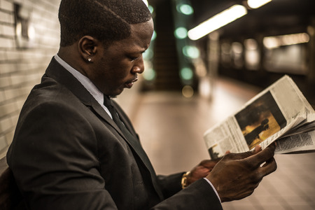 Businessman in full suit in New York subway metroの写真素材