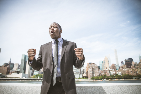 Confident happy businessman exultingの写真素材