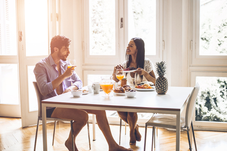 Couple in love eating breakfast in the morningの写真素材