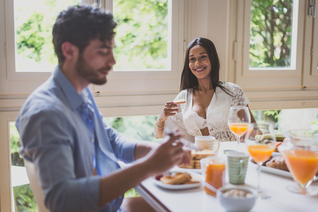 Couple in love eating breakfast in the morningの写真素材
