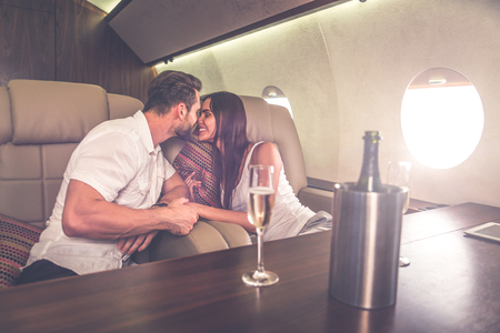 Couple on vacation, flying on their private jetの写真素材