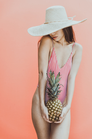 Beautiful asian young woman with bikini. Portraits on colored backgroundsの写真素材