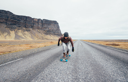 Skater traveling iceland on his longboardの写真素材