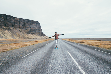 Skater traveling iceland on his longboardの写真素材