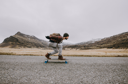 Skater traveling iceland on his longboardの写真素材