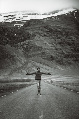 Skater traveling iceland on his longboardの写真素材