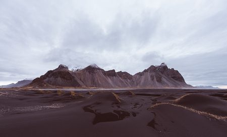 Wanderlust explorer discovering icelandic natural wonders. Stokksens Vestrahornの写真素材