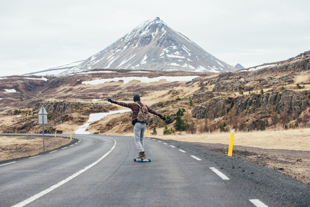 Skater traveling iceland on his longboardの写真素材