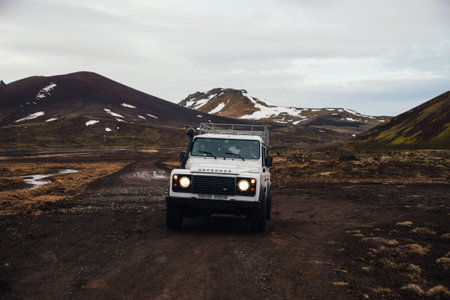 ICELAND, KIRKJUFELL, 16TH APRIL 2018. The land Rover defender parked in front the kirkjufell. The Defender  is a four-wheel drive off-road vehicle developed in the 1980sのeditorial素材