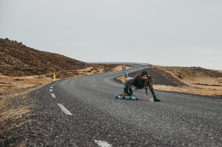Skater traveling iceland on his longboardの写真素材