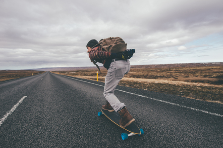 Skater traveling iceland on his longboardの写真素材