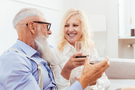 Senior couple in the 60's having fun at home - Cheerful married couple portrait, concepts about...