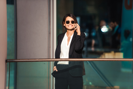 Beautiful businesswoman walking outdoors - Pretty young adult femaleの写真素材