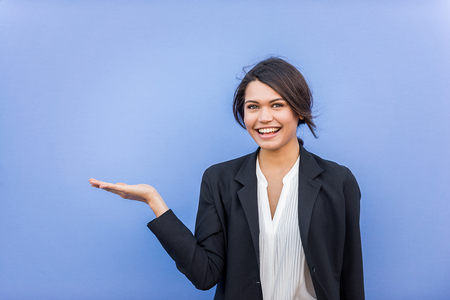 Beautiful businesswoman on colored background - Pretty young adult female portraitの写真素材