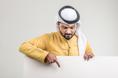 Portrait of arabic man with kandora in a studioの写真素材