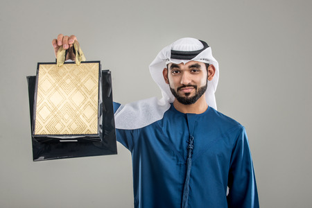 Portrait of arabic man with kandora in a studio
