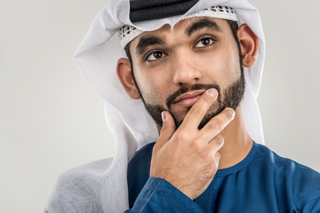 Portrait of arabic man with kandora in a studio