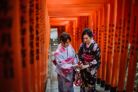 Two japanese girls wearing kimonos traditional clothes, lifestyle momentsのeditorial素材