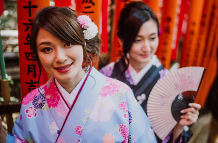 Two japanese girls wearing kimonos traditional clothes, lifestyle momentsのeditorial素材